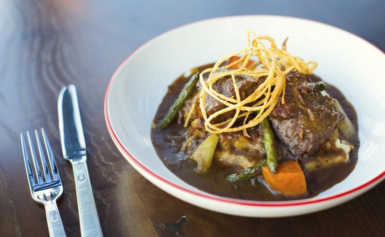 Plate with meat dish on it