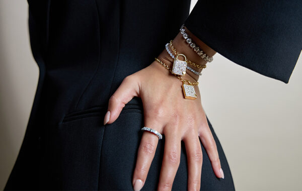 person's hand adorned with jewelry