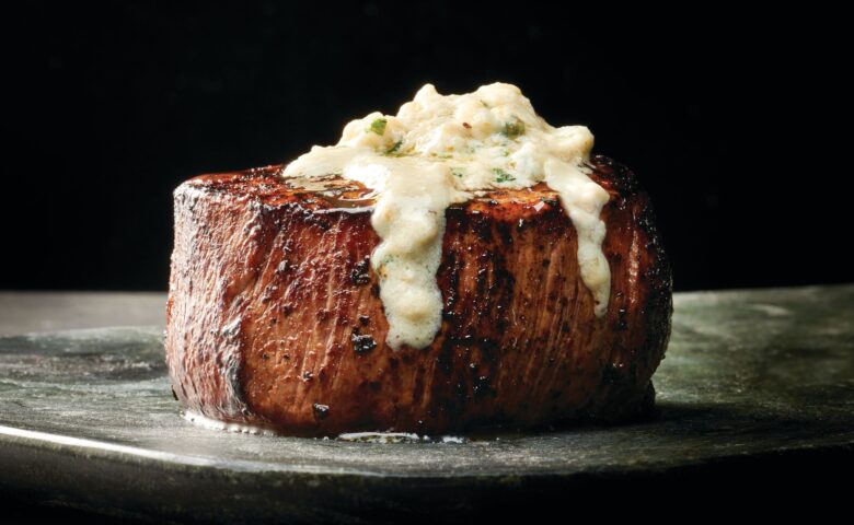 steak sitting on a plate