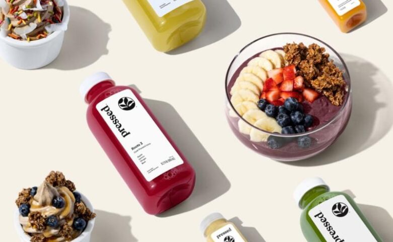 aerial view of pressed juices on a white surface