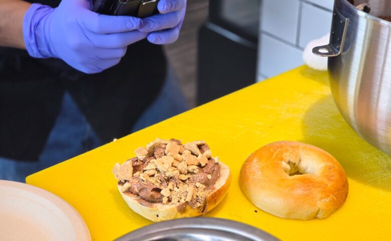 bagel on a yellow cutting board