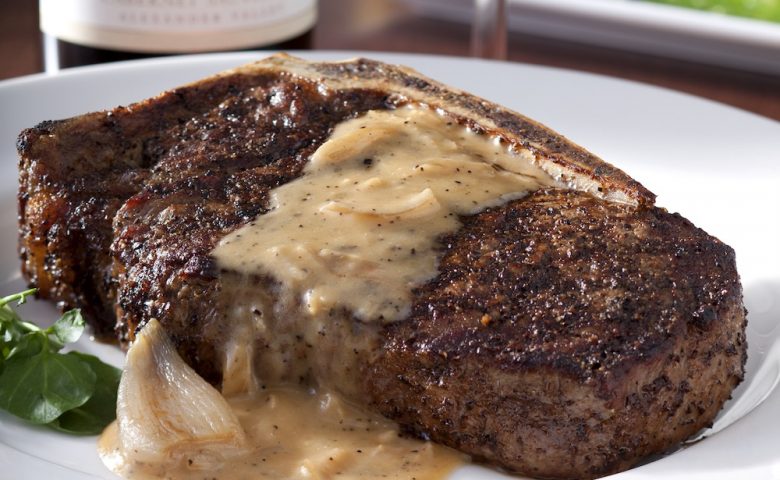 Steak with brown sauce on it on a plate